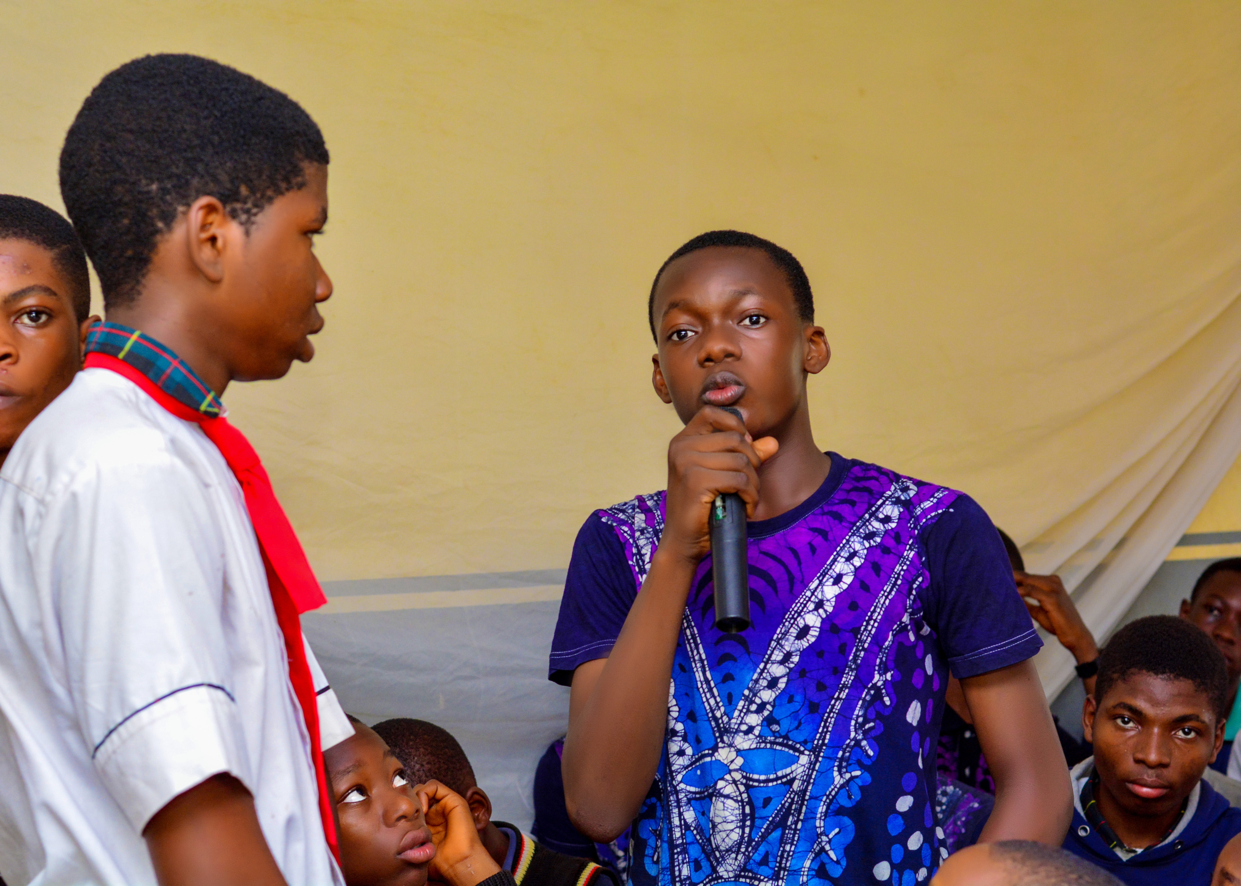 A boy speaking during a MaleMatters Conference session