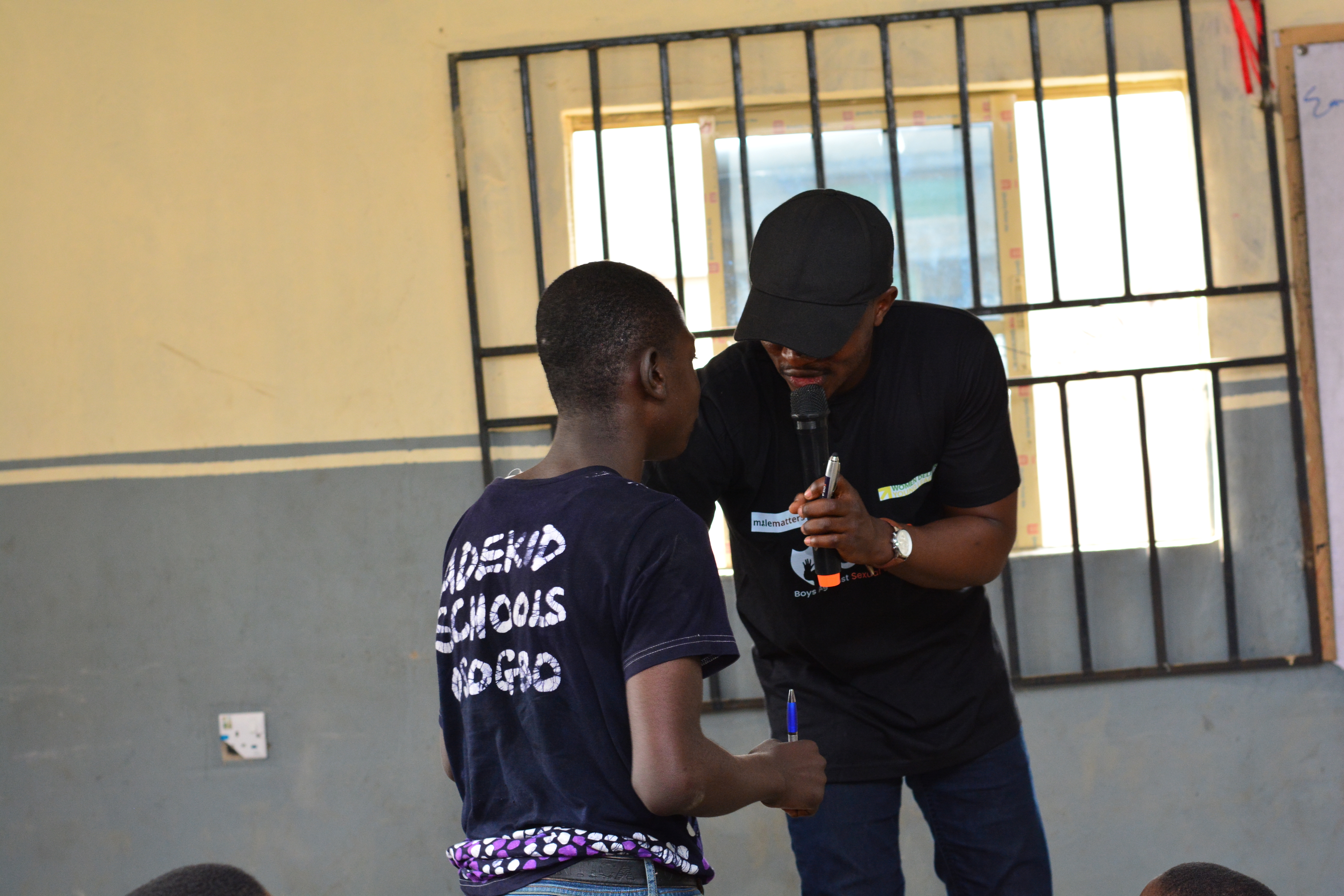 A MaleMatters facilitator speaking with a boy during a school programme